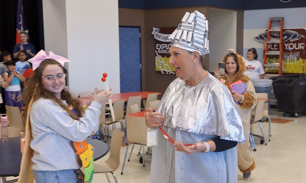 Camp1 Crystal Beach Crenshaw School students in costume applaud Principal Traci Camp during a surprise celebration for National Principals Month