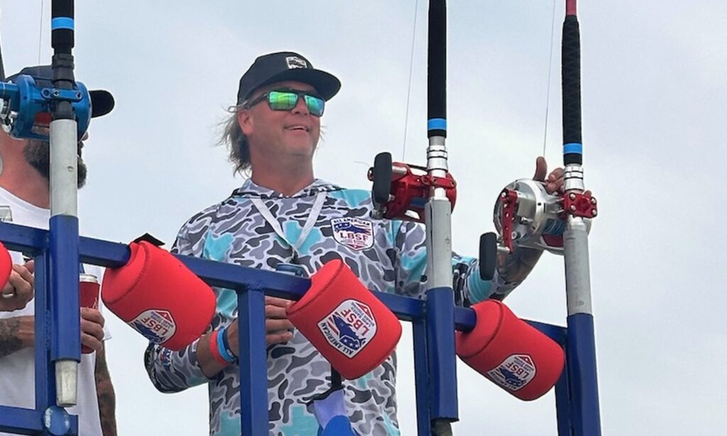 Fisherman standing behind surf rods