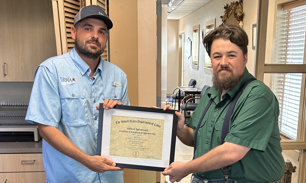 Apprentice employee receiving an award