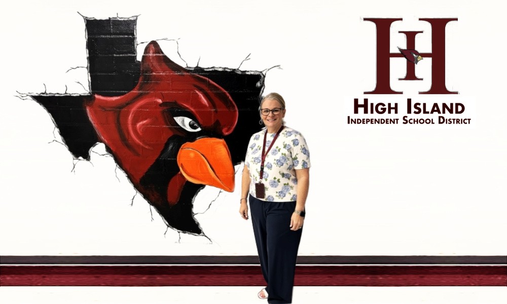 High Island ISD Superintendent Misti Smith standing in front of school logo