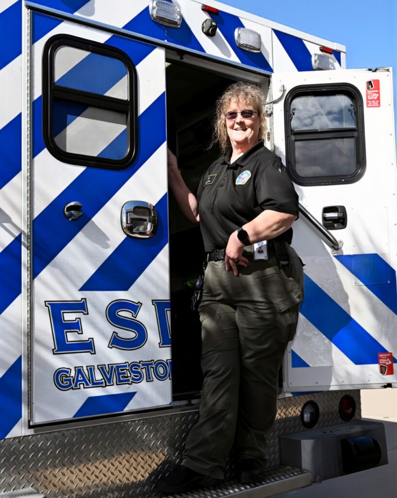 Dawn Blashill in front of ambulance