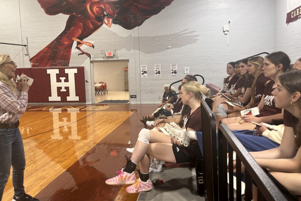 Coach Wiseman speaking to the High Island High School volleyball team
