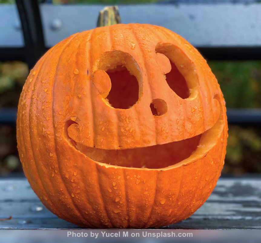 carved pumpkin with smiley face